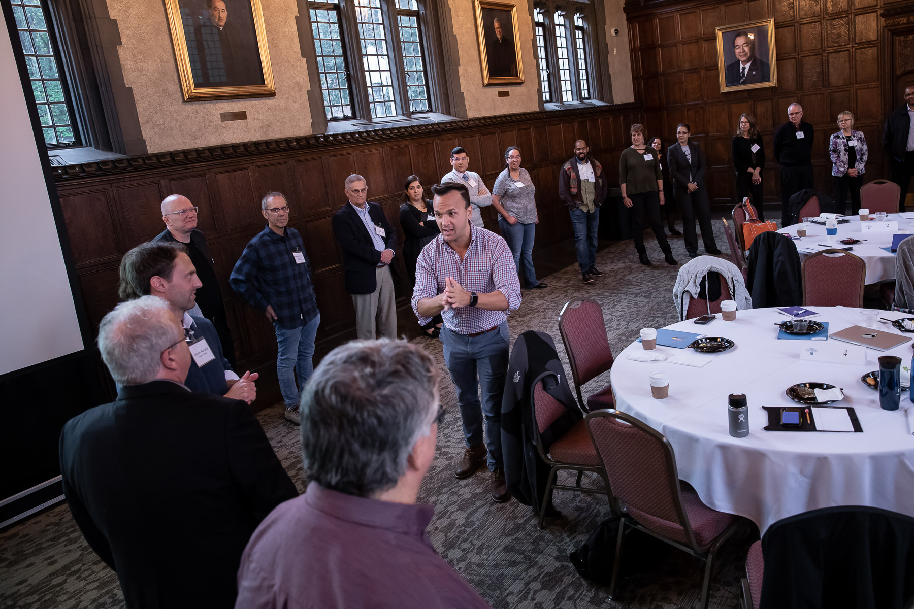 James Mourey, assistant professor of Marketing, demonstrates the game “Pass the Clap” from his keynote presentation and activity “Live from Chicago." (DePaul University/Jeff Carrion)